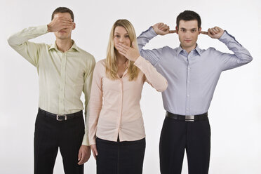 Business people gesturing see no evil, hear no evil, speak no evil - LDF00768