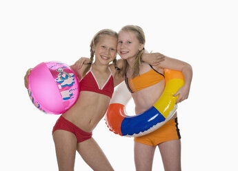 Two girls (10-11) wearing bikini, portrait - WWF01035