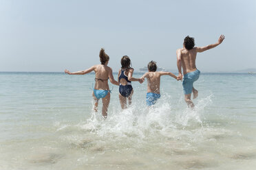 Spain, Mallorca, Family jumping into sea - WESTF12720