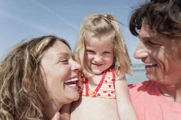 Spain, Mallorca, Family on beach, smiling, portrait - WESTF12716