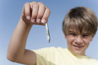 Boy Holds Little Fish Stock Photos - Free & Royalty-Free Stock