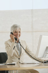 Senior woman using telephone - WESTF12834