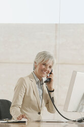 Senior woman using telephone - WESTF12833