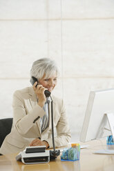 Senior woman using telephone - WESTF12828