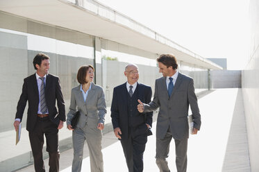 Spain, Mallorca, Business people walking together - WESTF12752