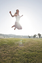 Spain, Mallorca, Woman jumping for joy - WESTF12732