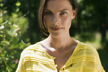 Germany, Hamburg, Woman in garden, portrait - WESTF13099