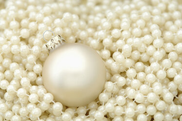 Christmas decoration, Pearls and Christmas bauble, elevated view - ASF03940