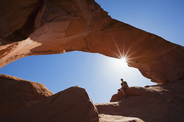 USA, Utah, Arches National Park, Person sittting near Skyline Arch - FOF01749