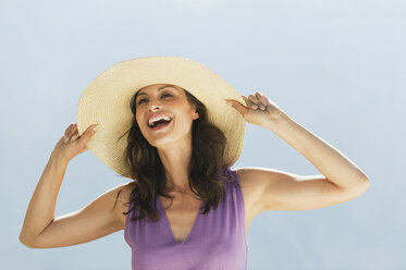 Italy, South Tyrol, Woman wearing hat, laughing, portrait - WESTF13689