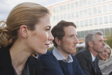 Germany, Hamburg, Four Business people in a row, portrait, close-up - WESTF13893