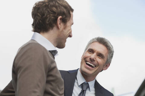 Germany, Hamburg, Two businessmen talking stock photo