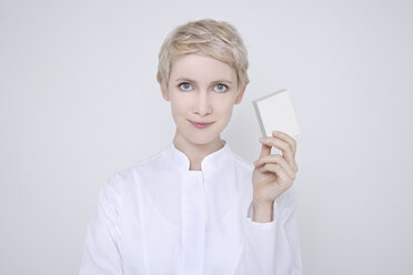 Female Doctor holding medicine, portrait - TCF01282