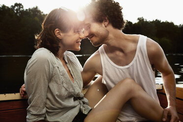 Germany, Berlin, Young couple on motor boat, head to head, portrait - VVF00075