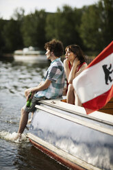 Germany, Berlin, Young couple on motor boat - VVF00066