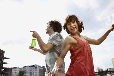 Germany, Berlin, Young couple dancing, laughing, portrait - VVF00054