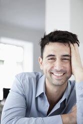 Businessman in office, smiling, portrait - JRF00166