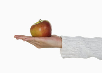 Person holding an apple - WWF01063