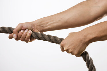Person pulling rope, close-up - RBF00185