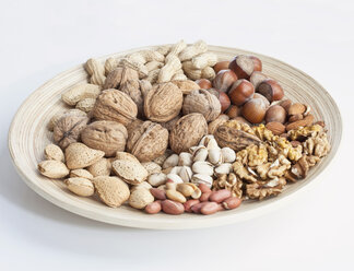 Variety of nuts on plate - MAEF01934