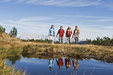 Austria, Salzburger Land, Four hikers in landscape - HHF03111