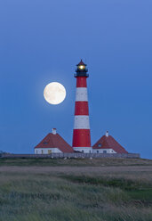 Germany, Schleswig Holstein, Westerhever lighthouse at night - RNF00247