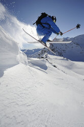 Italy, South Tyrol, Sulden, Man skiing downhill - MIRF00038