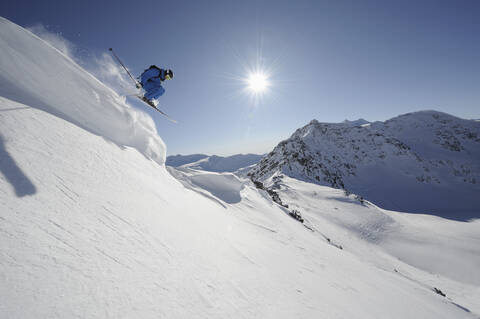 Italy, South Tyrol, Sulden, Man skiing downhill stock photo