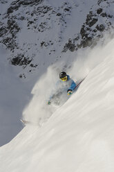 Italy, South Tyrol, Sulden, Man skiing downhill - MIRF00036