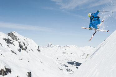 Austria, Arlberg, Man skiing downhill, doing jump - MIRF00029