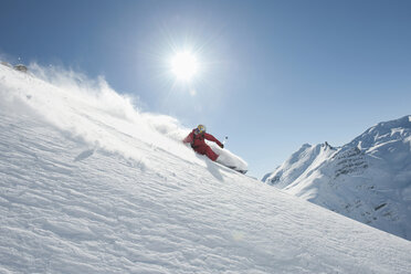 Austria, Arlberg. Man skiing downhill - MIRF00023