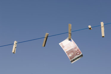 Germany, Euro banknote hanging on clothesline - CRF01842