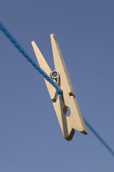 Germany, Clothespin on clothesline, close-up - CRF01841