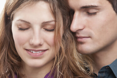 Young couple eyes closed, smiling - SSF00044