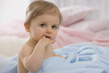 Baby girl (6-11 months) finger in mouth, portrait - SMOF00446