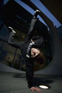 Man performing break dancing, portrait. - PKF00353