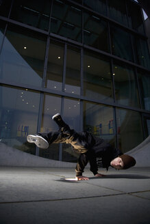 Man performing break dancing, portrait. - PKF00351