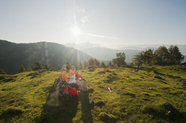 Young couple looking at a map on a mountaintop. - HHF03233