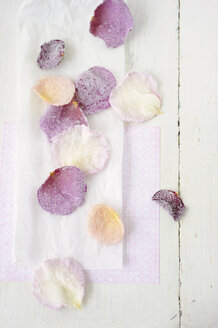 Sugared rose petals on wax paper, close up - COF00139