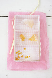 Candied lemon twist in rack on wax paper - COF00137