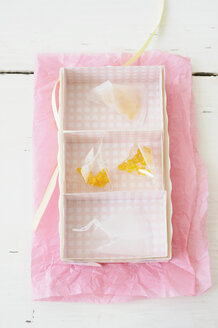 Candied lemon twist in rack on wax paper - COF00136