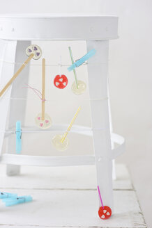 Handmade lollipops hanging on stool - COF00135