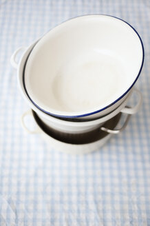 Stack of pots on table cloth, close up - COF00121