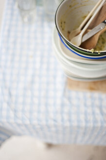 Stack of dirty dishes on table - COF00118