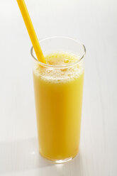 Glass of orange juice with straw on white background - CHKF01051
