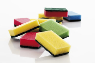 Multi coloured kitchen sponges against white background - 12183CS-U