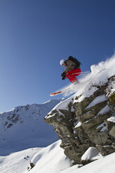 Austria, Tyrol, Kitzbuehel, Woman skiing on mountain - FFF01115