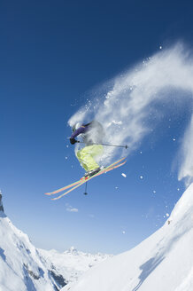 Austria, Man jumping on arlberg mountain - MIRF00055