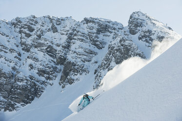 Austria, Woman skiing on arlberg mountain - MIRF00048