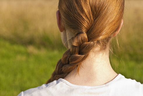 Germany, Bonn, Woman with braided hair, rear view - KJF00080